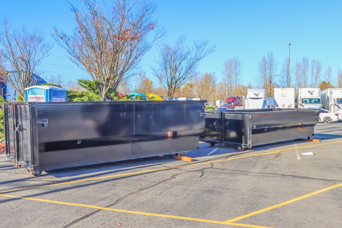 Professional dumpster rental service with roll-off container on residential driveway in Larkfield-Wikiup